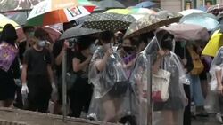 CLEAN : Soaked Hong Kong protesters again defy mask ban in huge rally News Clip