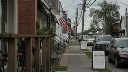 Various street views with cars driving through in Marshall News Clip
