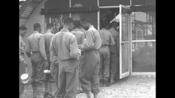 Ethiopian soldiers stand in line for food in Pusan During the Korean War News Clip