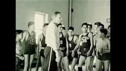 1950s: UNITED STATES: Window rock School sign. School bus drives to school. Children arrive at school Stock Footage