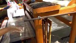 Woman hands weaving traditional carpet, closeup Stock Footage