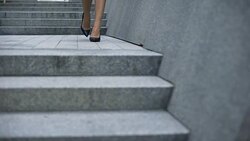 Woman hesitantly walking in high-heeled shoes, tired after work, varicose veins Stock Footage