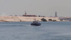 Boats moving through Suez Canal News Clip