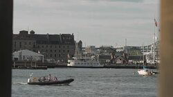 Boats, including a ferry and smaller vessels, travel in and out of Boston Harbor, USA. Stock Footage