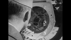 United States, 1952: An officer operates a camera mounted on a mobile mounted gun turrent Stock Footage