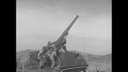 US troops fire cannons during the Korean War News Clip