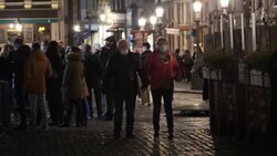 Shopper at night in Brussels Grand Place News Clip