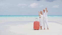 Caucasian seniors on beach filming social media video Stock Footage