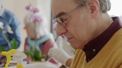 Active senior man learning to arrange flowers Stock Footage