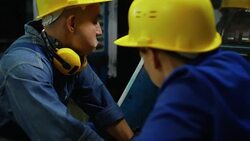 Man and Woman Fixing Printing Press Stock Footage