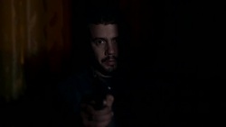 thief hidden in the darkness points the gun at the camera.Danger fear Stock Footage