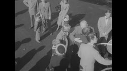 Newly appointed Supreme Court Justice Earl Warren and wife board plane for Washington, DC News Clip