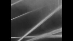 Firemen on break with hot drinks, one washing eye; 1930s News Clip