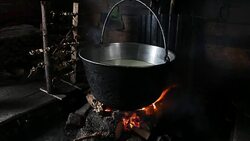 Steaming old-fashion pot over fire Stock Footage
