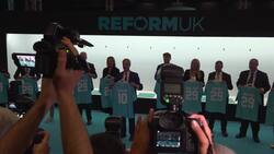 Farage shows off Reform 'football' shirts News Clip