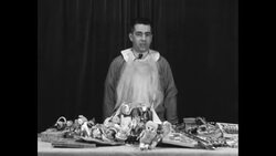 Disheveled Santa Claus with table of toys News Clip