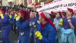 CLEAN : Members of a feminist flash mob are the unexpected stars of Paris anti pension march News Clip