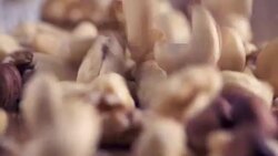 Mixed Super Foods Slow-Motion falling on wooden table, close up Stock Footage