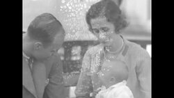 Quick clip of Franklin Roosevelt's oldest son, James, with his wife and infant daughter News Clip