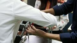 Teenage works on a fully functional programable Robot for robotics club project.Creative designer testing robotics prototype in workshop.Science concept Stock Footage