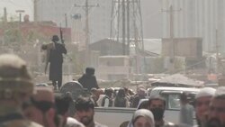 Military directing crowds at processing centre for people attempt to get out of the country News Clip