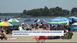 Bronx residents kick off holiday weekend in the sunshine at Orchard Beach News Clip