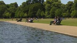 People sunbathing in Hyde Park News Clip
