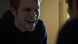 Crazy maniac wearing black face mask, smiling in front of mirror before attack Stock Footage