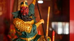 Buddhist traditional statues of chinese sacred gods on the altar inside the temple Stock Footage