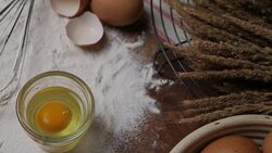Pastry Baking Accessories Bakery Background with flour and whisk. Ingredients for the preparation of bakery products. Stock Footage