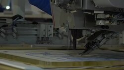 Automatic modern sewing machine embroider a pattern,Industrial embroidery equipment. Textile Manufacturers.Industrial textile factory,Textile Factory. Textile Industry. Stock Footage