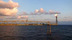 footage of oil and gas platform with flare burning bridge with sun rise and beautiful clouds in the morning for oil and gas industry concept. Stock Footage