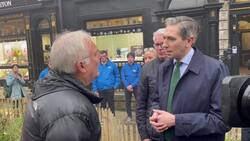Simon Harris confronts heckler who told Taoiseach he 'should be ashamed of himself' News Clip