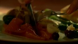 CLOSE ANGLE OF PLATE OF FOOD. ASPARAGUS, BREAD, EGGS. VEGETABLES. KNIFE AND FORK CUTS MEAT. Stock Footage