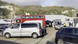 Dover: People wait on holding bus after 27 die in English Channel News Clip