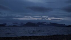 Dawn breaking across bay Ny Alesund in Svalbard, Norway News Clip