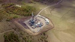 Aerial View of a Fracking Drilling Rig in the Autumn Mountains of Colorado Stock Footage
