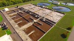 Aerial view to sewage treatment plant. Grey water recycling. Waste management theme. Stock Footage