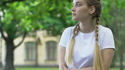 Teen boy late for date but gives flowers to girlfriend, pleasant surprise Stock Footage