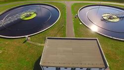 Aerial view to sewage treatment plant. Grey water recycling. Waste management theme. Stock Footage