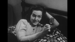 1950s: Wife lies on bed Stock Footage