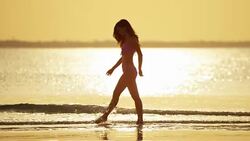 Young African American Asian Chinese girls on beach Stock Footage