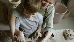 Woman Teaching Children to Make Pottery in Workshop Stock Footage