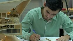 Architects are working on a building model at modern office. Designer are developing architecture. concept of construction, development and creative idea. Stock Footage