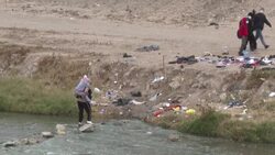 CLEAN : Migrants watch WC final at the US-Mexico border as they wait to cross News Clip