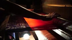 Craftsman working on huge old wooden brocade weaving looms Stock Footage