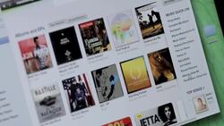 How to Play Music Purchased on iTunes Instructional Video