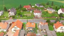 Camera flight over small village Lhota suburb of Pilsen. Living in agricultural landscape. Environmentally friendly living. Czech Republic, Europe. Stock Footage