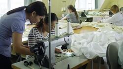 Woman Controlling Sewing Process Stock Footage