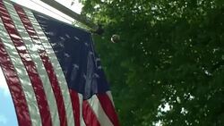 Sunlight shining through Revolutionary War era American flag. Stock Footage